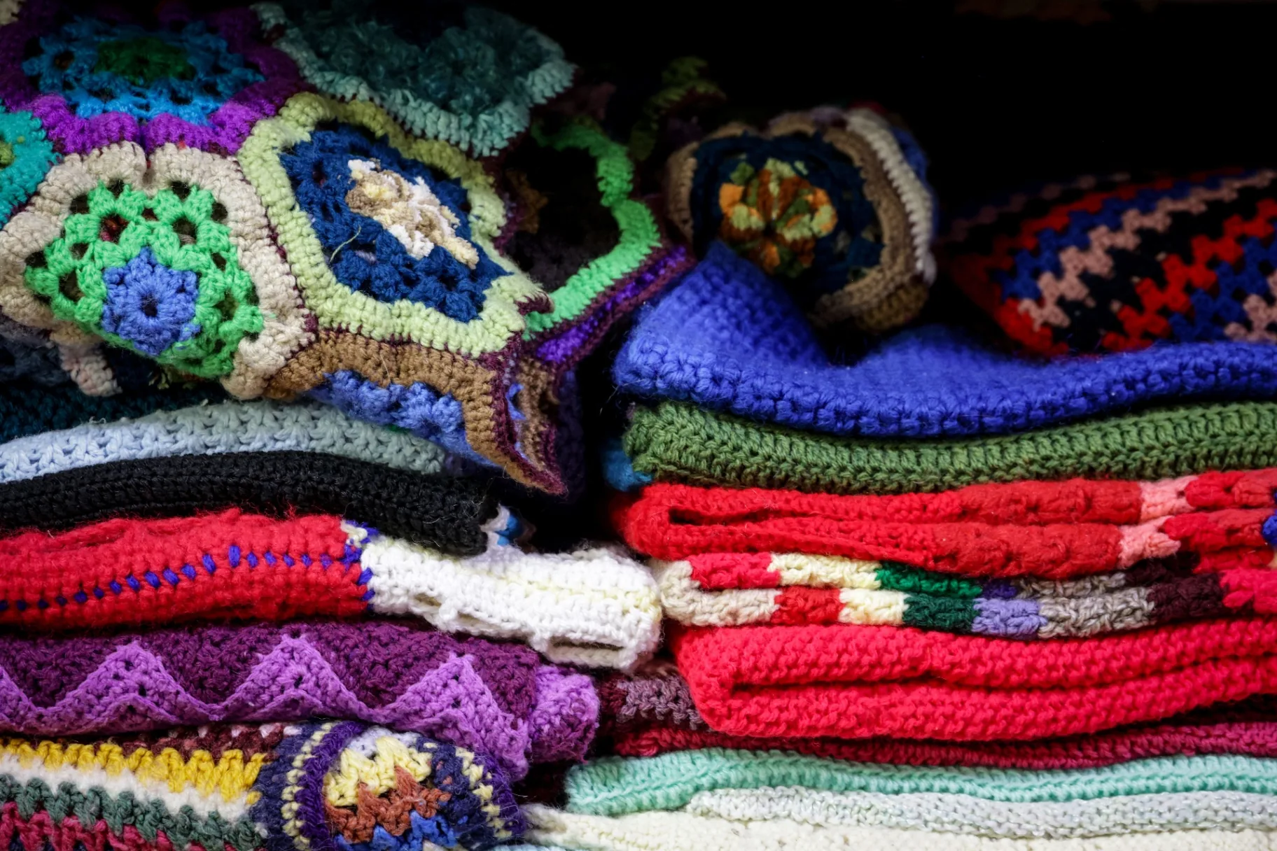 Stacks of colorful crochet items